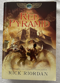 The Red Pyramid cover 
                    portaying two kids in the midst of a battle or high 
                    tension situation